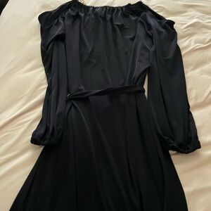 cocktail dress, hardware on the shoulders and gold very nice material black.